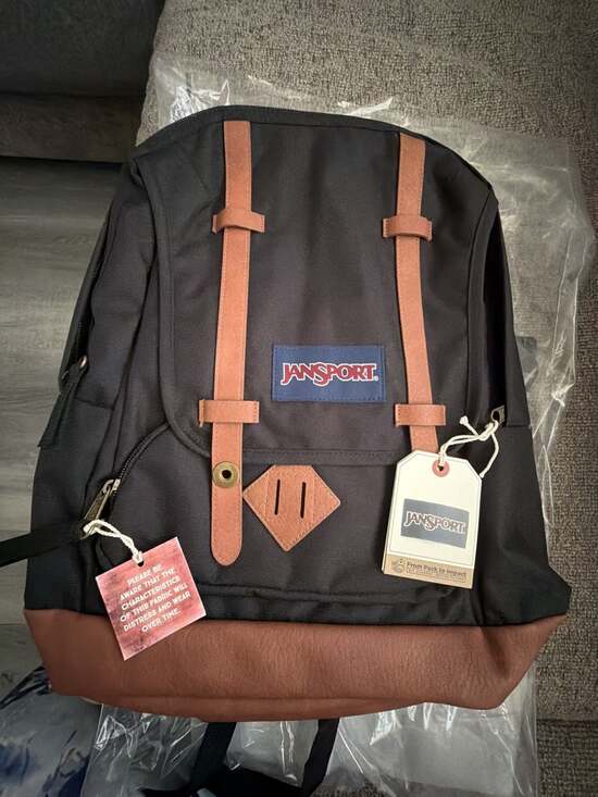 backpack jansport balck and brown Big Reveal Pack The clean black body with a contrast suede bottom delivers that laid Brown Text Logo JanSport Backpack